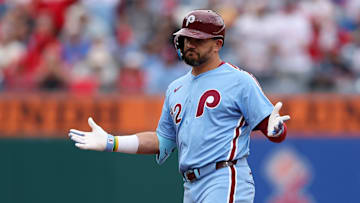 Apr 3, 2025; Philadelphia, Pennsylvania, USA; Philadelphia Phillies designated hitter Kyle Schwarber (12) reacts after reaching second base on a fielding error during the fifth inning against the Colorado Rockies at Citizens Bank Park. Mandatory Credit: Bill Streicher-Imagn Images