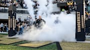 Nov 8, 2025; Nashville, Tennessee, USA;  Vanderbilt Commodores head coach Clark Lea leads the team onto the field against the Auburn Tigers during the first half at FirstBank Stadium. Mandatory Credit: Steve Roberts-Imagn Images