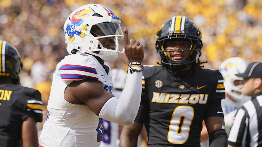 Kansas quarterback Jalon Daniels celebrates after scoring a touchdown against Missouri on Sept. 6.
