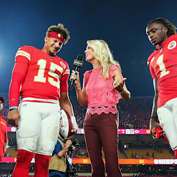 Sep 5, 2024; Kansas City, Missouri, USA; Kansas City Chiefs quarterback Patrick Mahomes (15) and wide receiver Xavier Worthy (1) talk with reporter Melissa Stark after defeating the Baltimore Ravens at GEHA Field at Arrowhead Stadium. Mandatory Credit: Jay Biggerstaff-Imagn Images