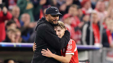 Lennart Karl embracing Vincent Kompany after dazzling on his first Champions League start for Bayern Munich.