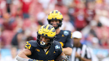 Dec 31, 2024; Tampa, FL, USA; Michigan Wolverines running back Jordan Marshall (23) runs with the ball against the Alabama Crimson Tide in the first quarter  during the ReliaQuest Bowl at Raymond James Stadium. Mandatory Credit: Nathan Ray Seebeck-Imagn Images