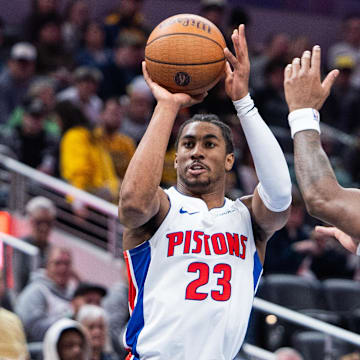 Detroit Pistons guard Jaden Ivey (23) shoots the ball while Indiana Pacers guard Bennedict Mathurin (00) defends