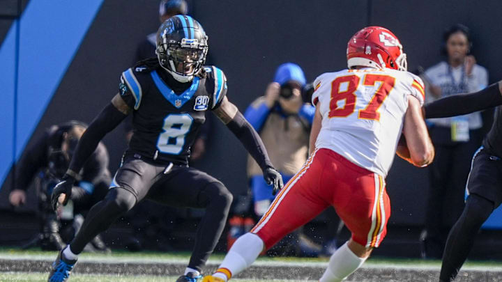 Nov 24, 2024; Charlotte, North Carolina, USA; Kansas City Chiefs tight end Travis Kelce (87) tries to elude Carolina Panthers cornerback Jaycee Horn (8) during the second quarter at Bank of America Stadium. Mandatory Credit: Jim Dedmon-Imagn Images Nov 24, 2024; Charlotte, North Carolina, USA; Kansas City Chiefs tight end Travis Kelce (87) tries to elude Carolina Panthers cornerback Jaycee Horn (8) during the second quarter at Bank of America Stadium. Mandatory Credit: Jim Dedmon-Imagn Images
