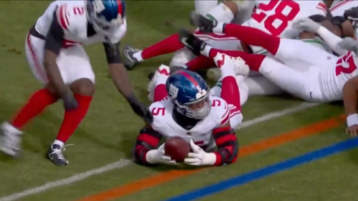 New York Giants edge rusher Kayvon Thibodeaux recovers an apparent fumble against the Philadelphia Eagles after a tush push play. New York Giants edge rusher Kayvon Thibodeaux recovers an apparent fumble against the Philadelphia Eagles after a tush push play.