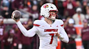 Nov 1, 2025; Blacksburg, Virginia, USA;  Louisville Cardinals quarterback Miller Moss (7) throws a pass against the Virginia Tech Hokies during the third quarter at Lane Stadium. Mandatory Credit: Brian Bishop-Imagn Images