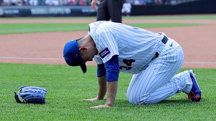 Jun 12, 2025; New York City, New York, USA; New York Mets starting pitcher Kodai Senga (34) reacts after sustaining an injury during the sixth inning against the Washington Nationals at Citi Field. Mandatory Credit: Brad Penner-Imagn Images