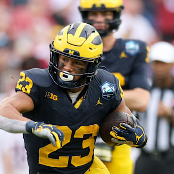 Dec 31, 2024; Tampa, FL, USA; Michigan Wolverines running back Jordan Marshall (23) runs with the ball against the Alabama Crimson Tide in the first quarter  during the ReliaQuest Bowl at Raymond James Stadium. Mandatory Credit: Nathan Ray Seebeck-Imagn Images
