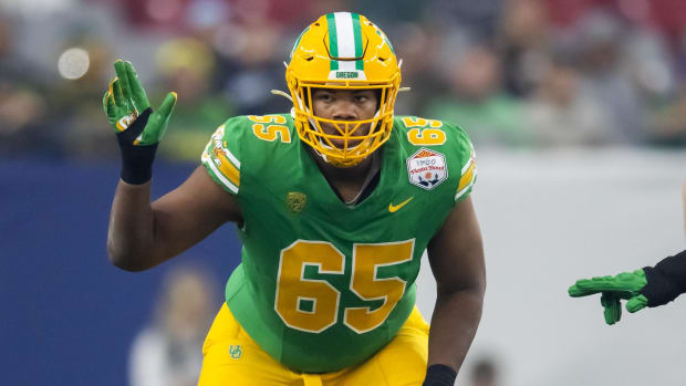 Oregon Ducks offensive lineman Ajani Cornelius (65) against the Liberty Flames during the 2024 Fiesta Bowl.