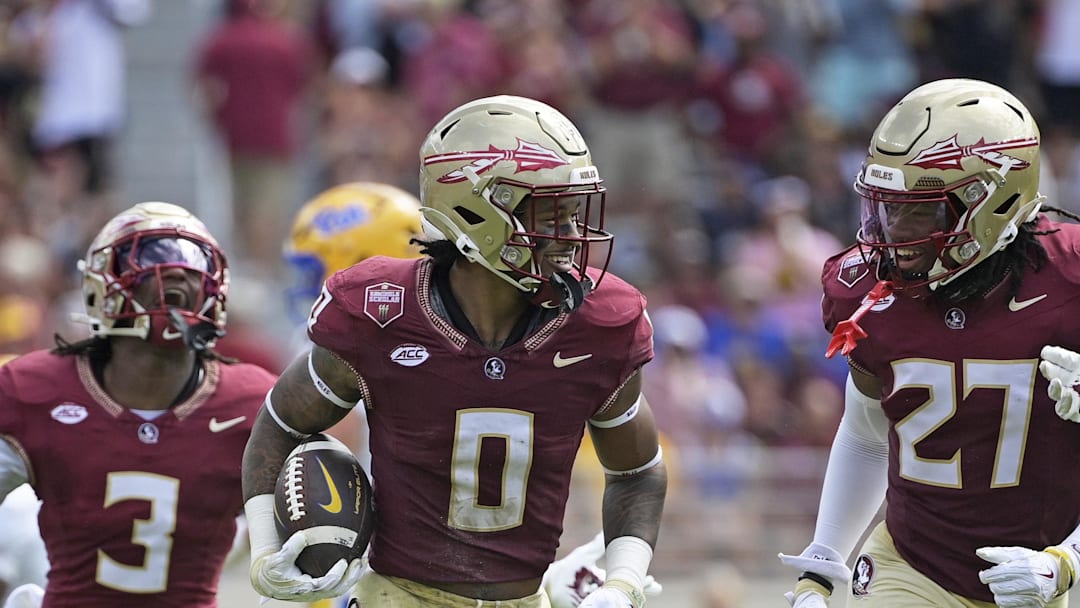 Oct 11, 2025; Tallahassee, Florida, USA; Florida State Seminoles safety Earl Little Jr. (0), defensive back Ashlynd Barker (27), defensive back Edwin Joseph (3), and defensive back Ja'Bril Rawls (11) celebrate after an interception during the first half of the game against the Pittsburgh Panthers at Doak S. Campbell Stadium. Mandatory Credit: Melina Myers-Imagn Images