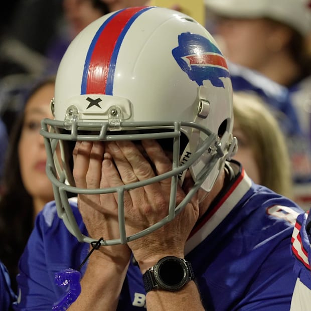 fan covers his eyes just before the Bills attempted a two-point conversion