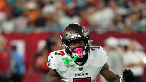 Aug 23, 2024; Tampa, Florida, USA;  Tampa Bay Buccaneers running back Bucky Irving (7) runs with the ball against the Miami D