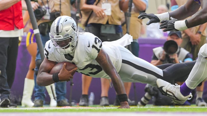 Aug 10, 2024; Minneapolis, MN; Las Vegas Raiders quarterback Anthony Brown Jr. (13) dives against the Minnesota Vikings in the fourth quarter at U.S. Bank Stadium.  