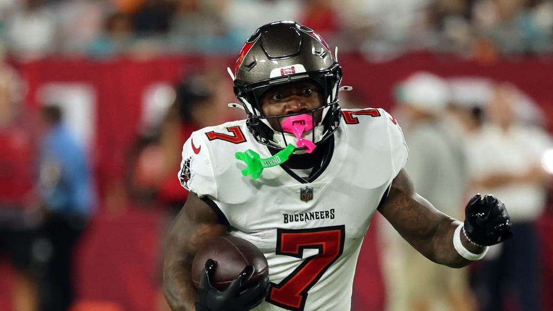 Aug 23, 2024; Tampa, Florida, USA;  Tampa Bay Buccaneers running back Bucky Irving (7) runs with the ball against the Miami Dolphins during the second quarter at Raymond James Stadium. Mandatory Credit: Kim Klement Neitzel-USA TODAY Sports