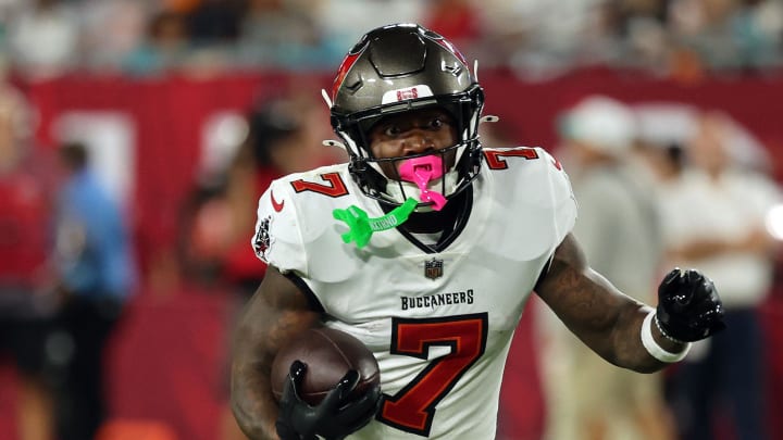 Aug 23, 2024; Tampa, Florida, USA;  Tampa Bay Buccaneers running back Bucky Irving (7) runs with the ball against the Miami Dolphins during the second quarter at Raymond James Stadium. Mandatory Credit: Kim Klement Neitzel-USA TODAY Sports