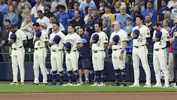Oct 11, 2025; Milwaukee, Wisconsin, USA; Milwaukee Brewers players line up for the national anthem before game five against the Chicago Cubs in the NLDS round for the 2025 MLB playoffs at American Family Field. Mandatory Credit: Michael McLoone-Imagn Images