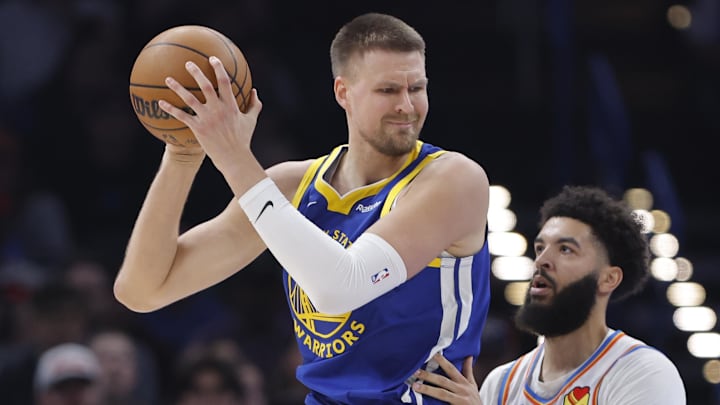 Mar 7, 2026; Oklahoma City, Oklahoma, USA; Golden State Warriors forward/center Kristaps Porziņģis (7) moves the ball against Oklahoma City Thunder guard/forward Kenrich Williams (34) during the first half at Paycom Center. Mandatory Credit: Alonzo Adams-Imagn Images
