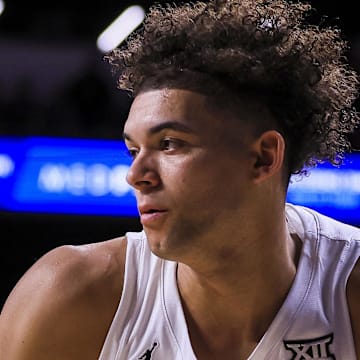 Feb 8, 2025; Cincinnati, Ohio, USA; Cincinnati Bearcats guard Dan Skillings Jr. (0) dribbles against the Brigham Young Cougars in the first half at Fifth Third Arena. Mandatory Credit: Katie Stratman-Imagn Images