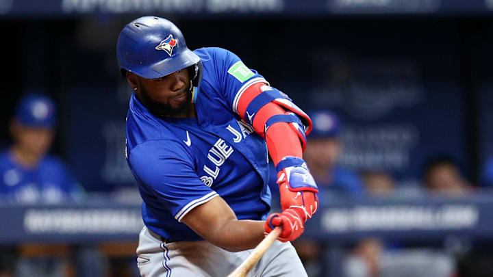 Toronto Blue Jays third baseman Vladimir Guerrero Jr. (27) hits a single against the Tampa Bay Rays in the fifth inning at Tropicana Field in 2024.