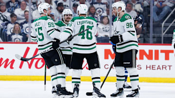 May 7, 2025; Winnipeg, Manitoba, CAN; Dallas Stars forward Mikko Rantanen (96) is congratulated by his team mates on his goal against the Winnipeg Jets during the second period in game one of the second round of the 2025 Stanley Cup Playoffs at Canada Life Centre. Mandatory Credit: Terrence Lee-Imagn Images