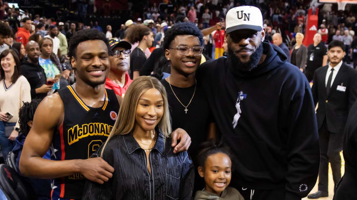 West guard Bronny James (6) poses for a family photo with with mother Savannah James, brother Bryce Maximus James, sister Zhuri Nova James and father LeBron James following the McDonald's All American Boy's high school basketball game at Toyota Center. 