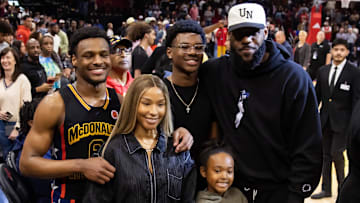Mar 28, 2023; Houston, TX, USA; West guard Bronny James (6) poses for a family photo with with mother Savannah James, brother Bryce Maximus James, sister Zhuri Nova James and father LeBron James following the McDonald's All American Boy's high school basketball game at Toyota Center. Mandatory Credit: Mark J. Rebilas-Imagn Images