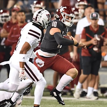 WSU quarterback John Mateer carries the ball against Texas Tech for some of his 197 yards rushing. 