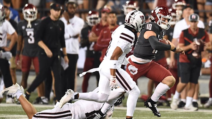 WSU quarterback John Mateer carries the ball against Texas Tech for some of his 197 yards rushing. 