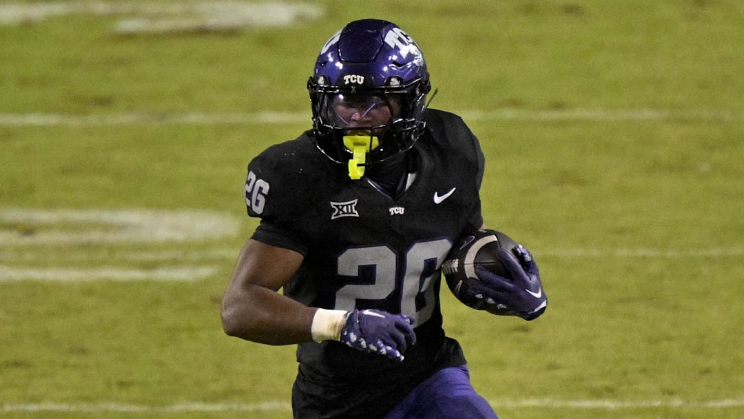 TCU Horned Frogs running back Jeremy Payne (26) runs with the ball during the game between the Horned Frogs and the Bearcats at Amon G. Carter Stadium. 