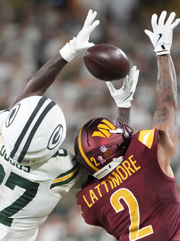 Packers wide receiver Romeo Doubs (87) cannot make a catch against Washington Commanders cornerback Marshon Lattimore (2).