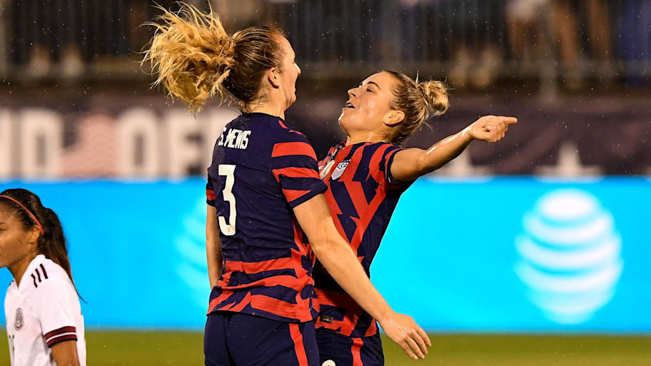 USWNT’s Kristie Mewis celebrates a goal with Sam Mewis against Mexico.