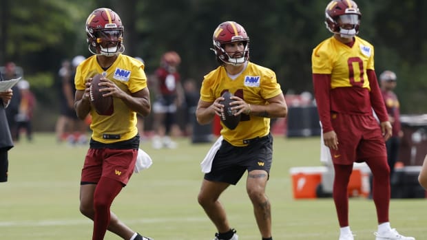 Commanders quarterbacks Jayden Daniels and Sam Hartman both drop back to pass in practice