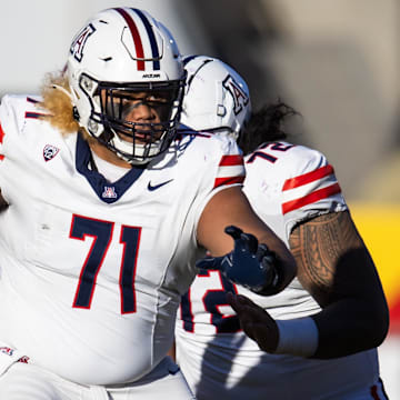 Nov 25, 2023; Tempe, Arizona, USA; Arizona Wildcats offensive lineman Jonah Savaiinaea (71) against the Arizona State Sun Devils during the Territorial Cup at Mountain America Stadium.