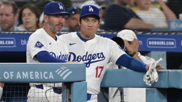 Aug 5, 2024; Los Angeles, California, USA;  Los Angeles Dodgers designated hitter Shohei Ohtani (17) talks with first base coach Clayton McCullough (86) in the dugout during the eighth inning against the Philadelphia Phillies at Dodger Stadium. Mandatory Credit: Jayne Kamin-Oncea-USA TODAY Sports