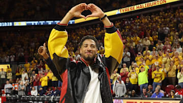 Mar 1, 2025; Ames, Iowa, USA;  Former Iowa State Cyclones and current USA Olympic Gold Medalist Tyrese Haliburton is celebrated during half-time of their game with the Arizona Wildcats at James H. Hilton Coliseum. Mandatory Credit: Reese Strickland-Imagn Images