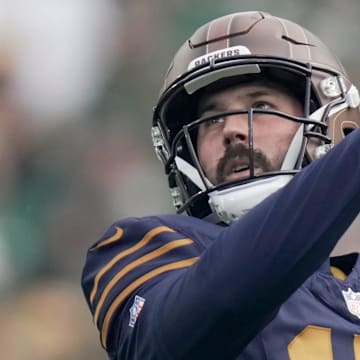 Green Bay Packers place kicker Brandon McManus (17) watches his extra point against Carolina.
