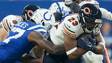 Indianapolis Colts linebacker Jaylon Carlies (57) tackles Chicago Bears running back Roschon Johnson (23) on Sunday, Sept. 22, 2024, during a game against the Chicago Bears at Lucas Oil Stadium in Indianapolis.