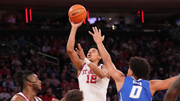 Mar 15, 2025; New York, NY, USA;  St. John's basketball guard RJ Luis Jr. (12) shoots against the Creighton Bluejays in the first half at Madison Square Garden.