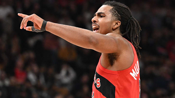 Apr 1, 2026; Toronto, Ontario, CAN;  Toronto Raptors forward Collin Murray-Boyles (12) gestures as he speaks to a teammate in the first half against the Sacramento Kings at Scotiabank Arena. Mandatory Credit: Dan Hamilton-Imagn Images