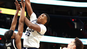 Dec 2, 2024; Washington, District of Columbia, USA; Georgetown Hoyas forward Thomas Sorber (35) shoots the ball over UMBC Retrievers forward Josh Odunowo (2) during the first half at Capital One Arena. Mandatory Credit: Daniel Kucin Jr.-Imagn Images
