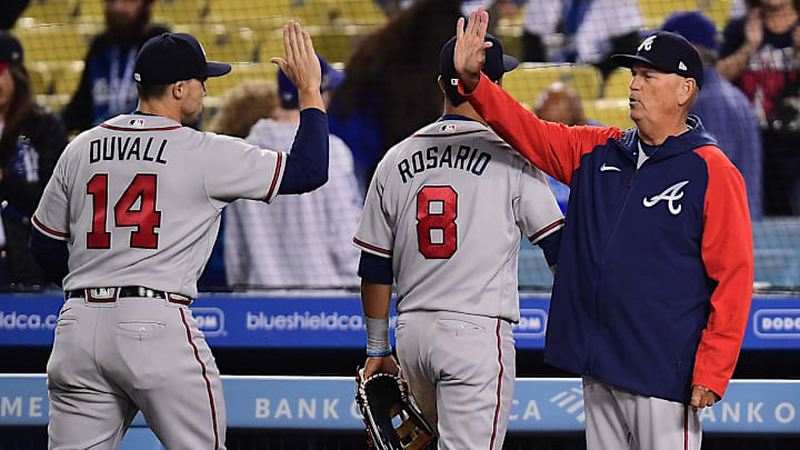 Braves manager Brian Snitker (43) center fielder Adam Duvall (14) and right fielder Eddie Rosario (8 celebrate the victory against the Los Angeles Dodgers at Dodger Stadium.