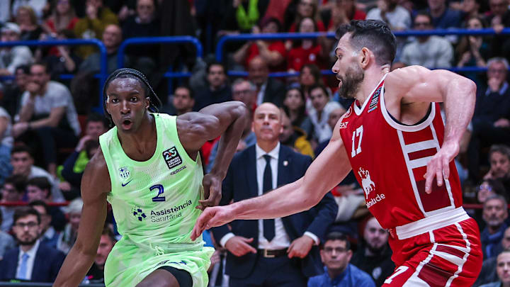 (L-R) Dame Sarr #2 of FC Barcelona competes for the ball...