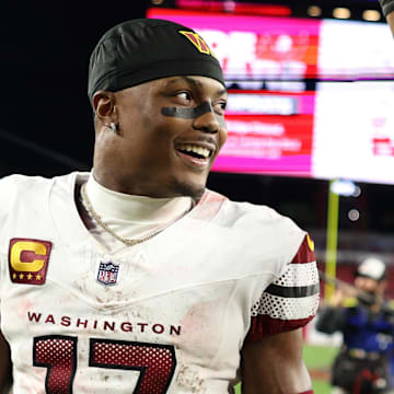 Jan 12, 2025; Tampa, Florida, USA; Washington Commanders wide receiver Terry McLaurin (17) and linebacker Bobby Wagner (54) celebrate after winning a NFC wild card playoff against the Tampa Bay Buccaneers at Raymond James Stadium. Mandatory Credit: Nathan Ray Seebeck-Imagn Images