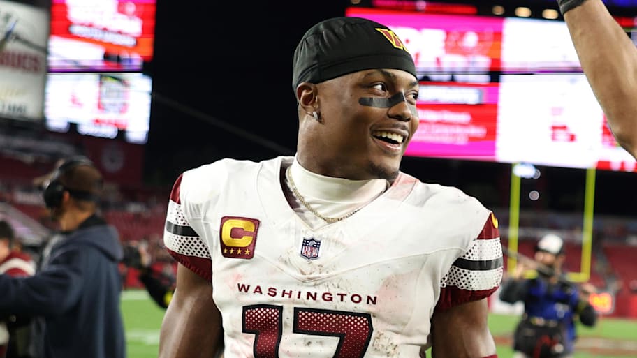 Jan 12, 2025; Tampa, Florida, USA; Washington Commanders wide receiver Terry McLaurin (17) and linebacker Bobby Wagner (54) celebrate after winning a NFC wild card playoff against the Tampa Bay Buccaneers at Raymond James Stadium. Mandatory Credit: Nathan Ray Seebeck-Imagn Images | Nathan Ray Seebeck-Imagn Images