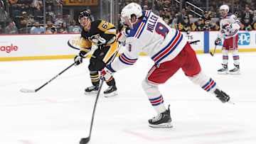 Feb 23, 2025; Pittsburgh, Pennsylvania, USA;  New York Rangers left wing J.T. Miller (8) shoots to score an empty net goal against the Pittsburgh Penguins during the third period at PPG Paints Arena. Mandatory Credit: Charles LeClaire-Imagn Images