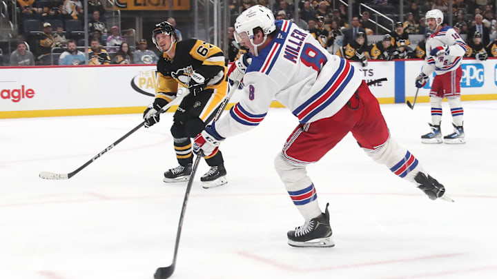 Feb 23, 2025; Pittsburgh, Pennsylvania, USA; New York Rangers left wing J.T. Miller (8) shoots to score an empty net goal against the Pittsburgh Penguins during the third period at PPG Paints Arena. Mandatory Credit: Charles LeClaire-Imagn Images Feb 23, 2025; Pittsburgh, Pennsylvania, USA; New York Rangers left wing J.T. Miller (8) shoots to score an empty net goal against the Pittsburgh Penguins during the third period at PPG Paints Arena. Mandatory Credit: Charles LeClaire-Imagn Images