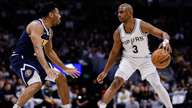  San Antonio Spurs guard Chris Paul (3) controls the ball as Denver Nuggets guard Jalen Pickett (24) 