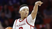 Feb 26, 2025; Norman, Oklahoma, USA; Oklahoma Sooners guard Jeremiah Fears (0) gestures to his team during a play against the Kentucky Wildcats during the second half at Lloyd Noble Center. Mandatory Credit: Alonzo Adams-Imagn Images