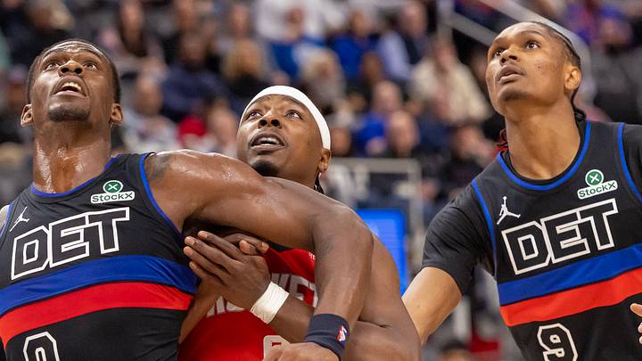 Jan 23, 2026; Detroit, Michigan, USA; Detroit Pistons center Jalen Duren (0) and guard Ausar Thompson (9) box out Houston Rockets forward Jae'sean Tate (8) during the first half at Little Caesars Arena. Mandatory Credit: David Reginek-Imagn Images
