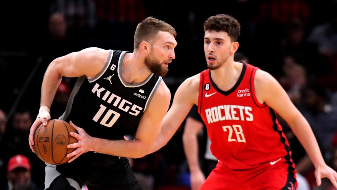 Feb 8, 2023; Houston, Texas, USA; Sacramento Kings forward Domantas Sabonis (10) handles the ball against Houston Rockets center Alperen Sengun (28) during the first quarter at Toyota Center. Feb 8, 2023; Houston, Texas, USA; Sacramento Kings forward Domantas Sabonis (10) handles the ball against Houston Rockets center Alperen Sengun (28) during the first quarter at Toyota Center.